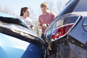 two drivers exchange details after accident