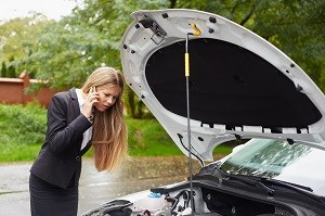 woman with a broken down car