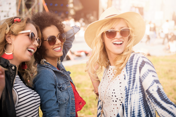 Friends dancing at a festival