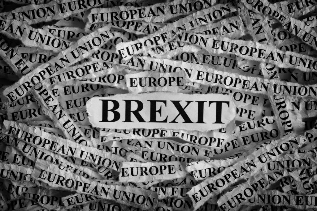 Brexit. Torn pieces of paper with the word Brexit. Concept Image. Black and White. Closeup. Photo 73543368 © Stepan Popov